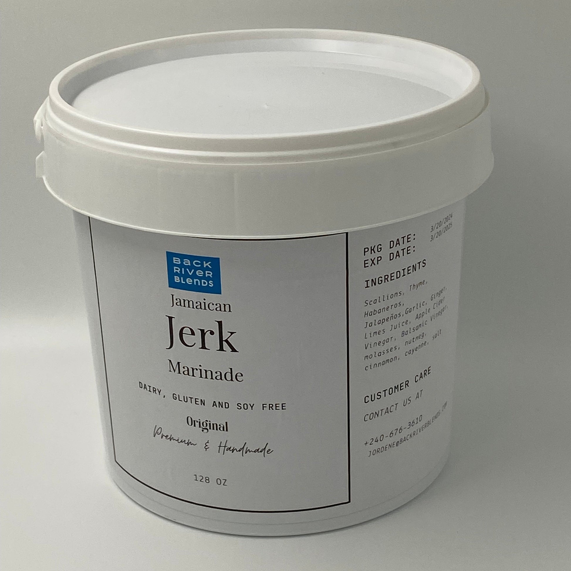 White container Holding Jamaican jerk marinade in gallon size.
